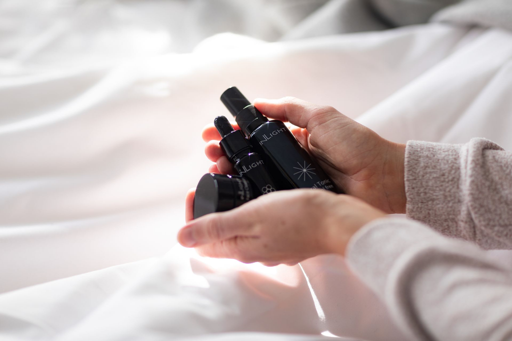 Inlight Model Holding Mini Face Oil, Floral Tonic, Face Cleanser.webp